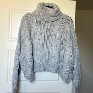 slightly cropped turtleneck sweater